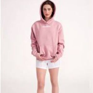 Glossier light pink sweatshirt, size Medium